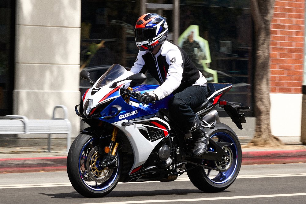 Dustin rides the GSX-R1000RS through an urban area.