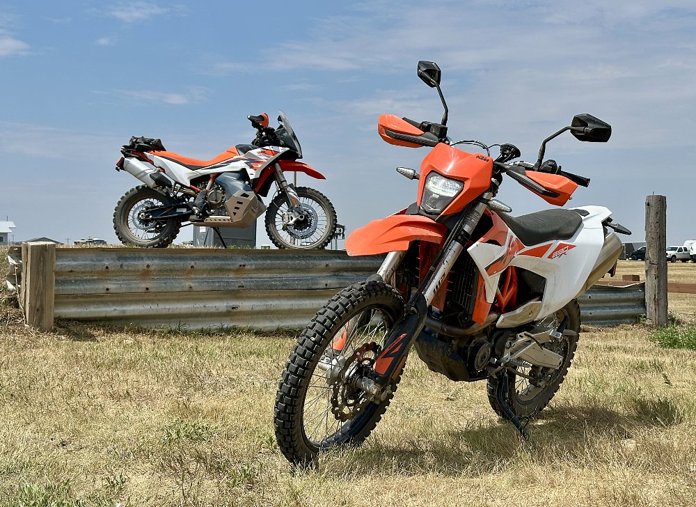 2026 KTM 690 Enduro R parked with a KTM 890 Adventure R in the background.