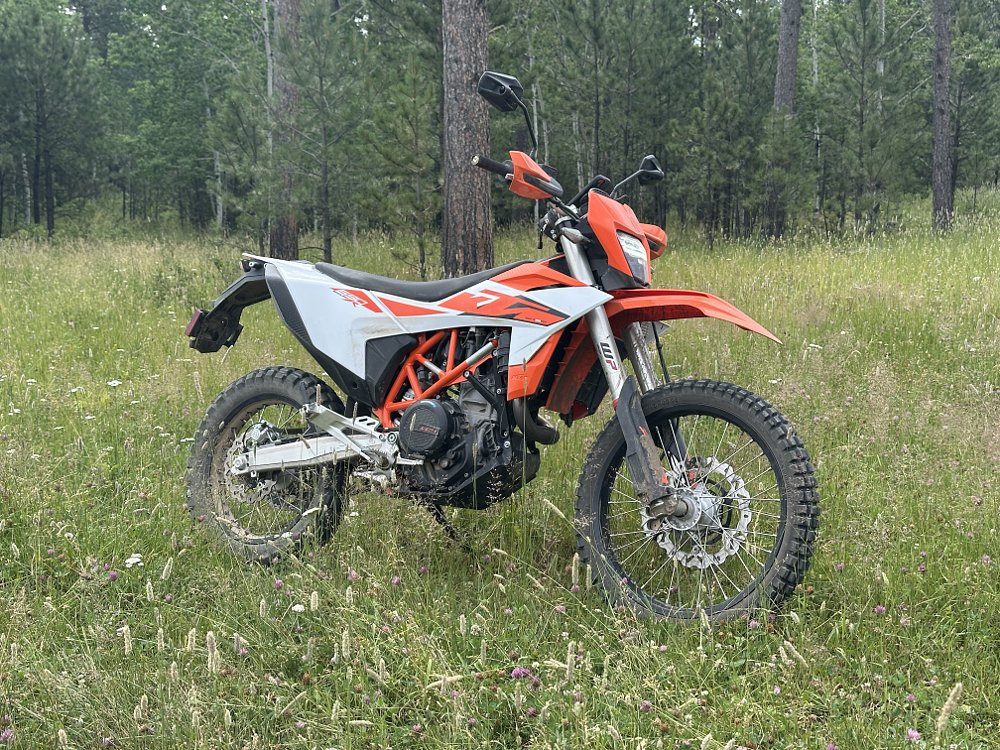 2026 KTM 690 Enduro R parked in tall grass.