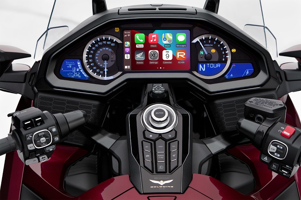 view of the broad digital display on a Honda Gold Wing and rows of buttons below it