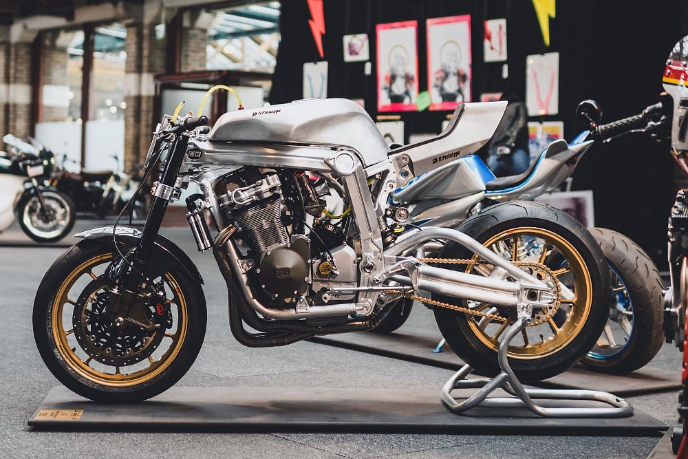left side view of the silver custom GSX-R1100 on a stand