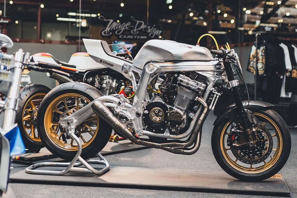 custom silver-colored Suzuki GSX-R1100 in the workshop on a stand