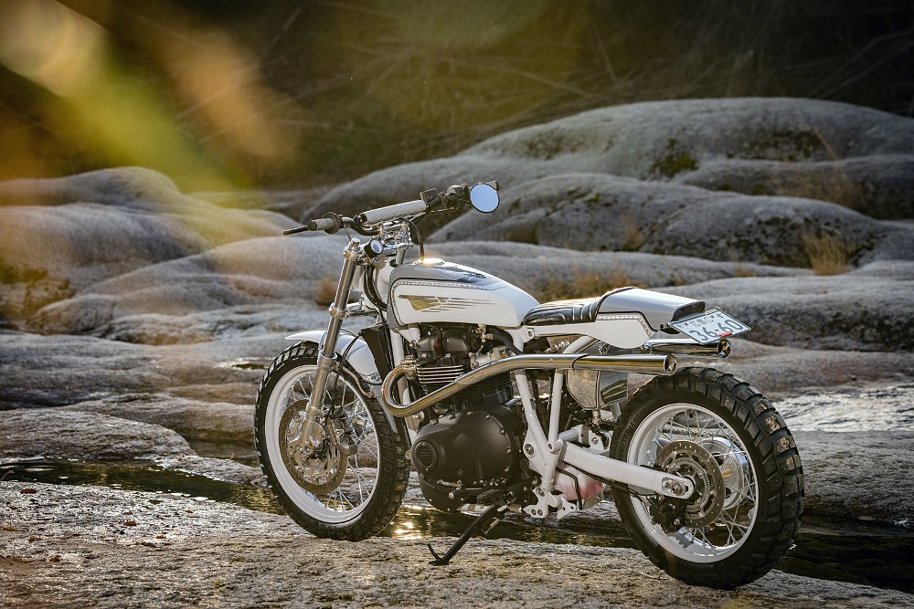 left side view of the airy-looking lightweight scrambler with white and silver paint