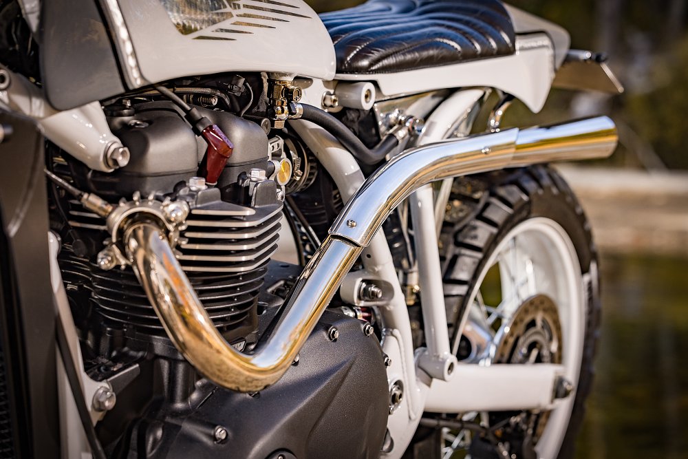 close view of the curving chromed exhaust pipe