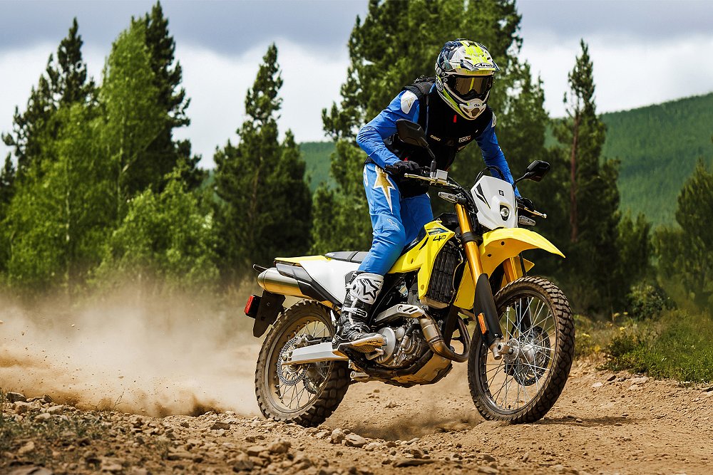 An off-road rider sends roost up behind his DR-Z4S.