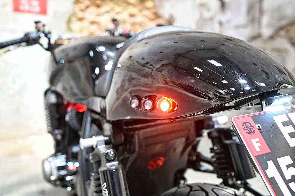 close view of the tail section with a row of red lights
