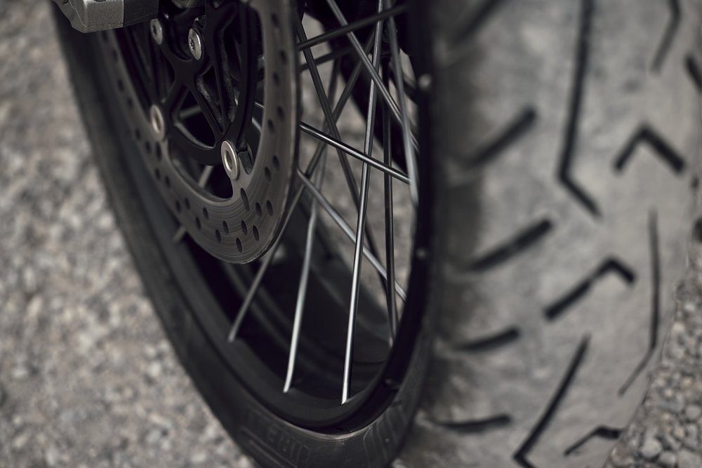 close view of the spoked wheel and street-oriented tire