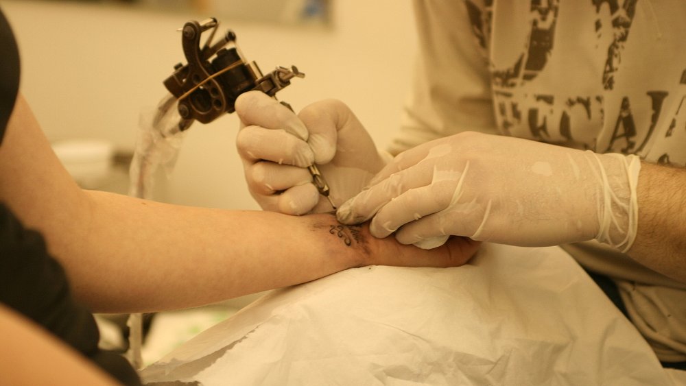 tattoo artist at work