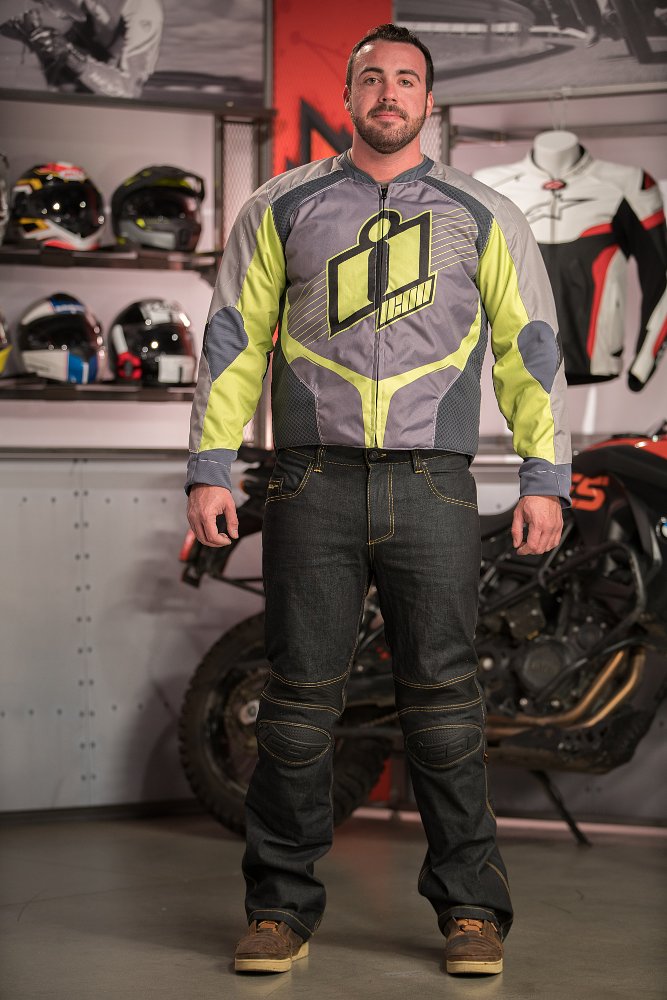 Model wearing Icon Overlord Textile Jacket and Icon Hooligan Denim Pants