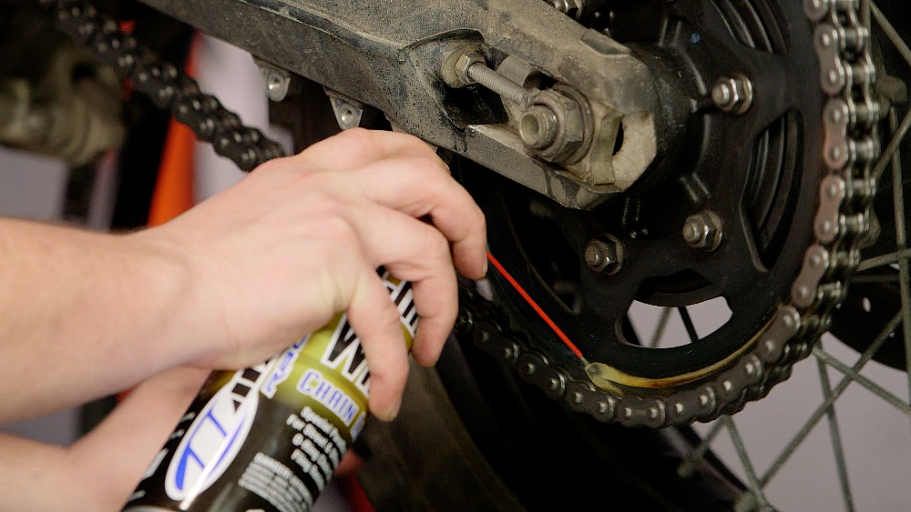 Applying Lubricant To A Motorcycle Chain