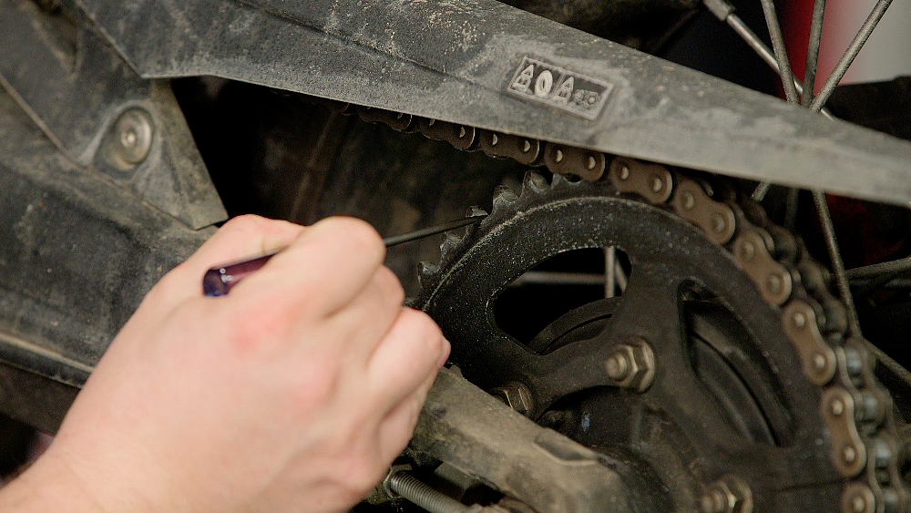 Examining A Motorcycle Chain