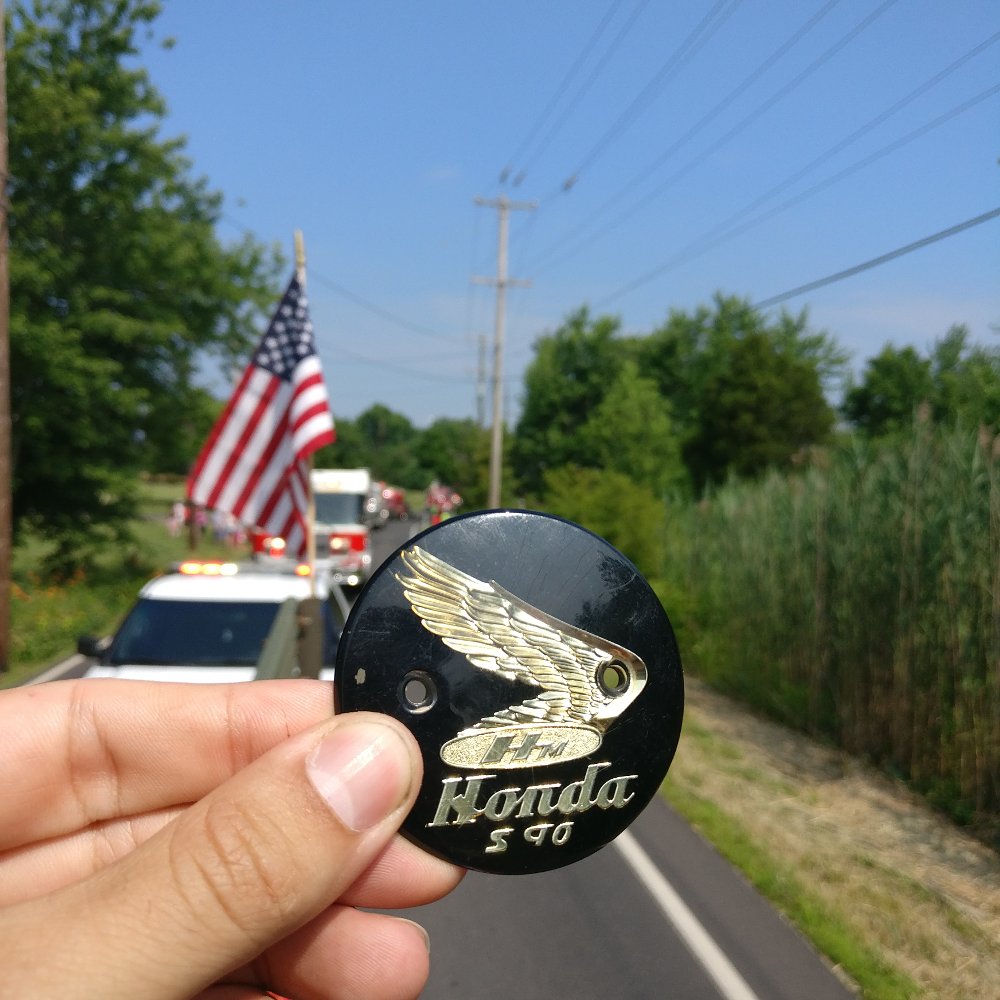 Honda S90 badge in a parade. Sad!