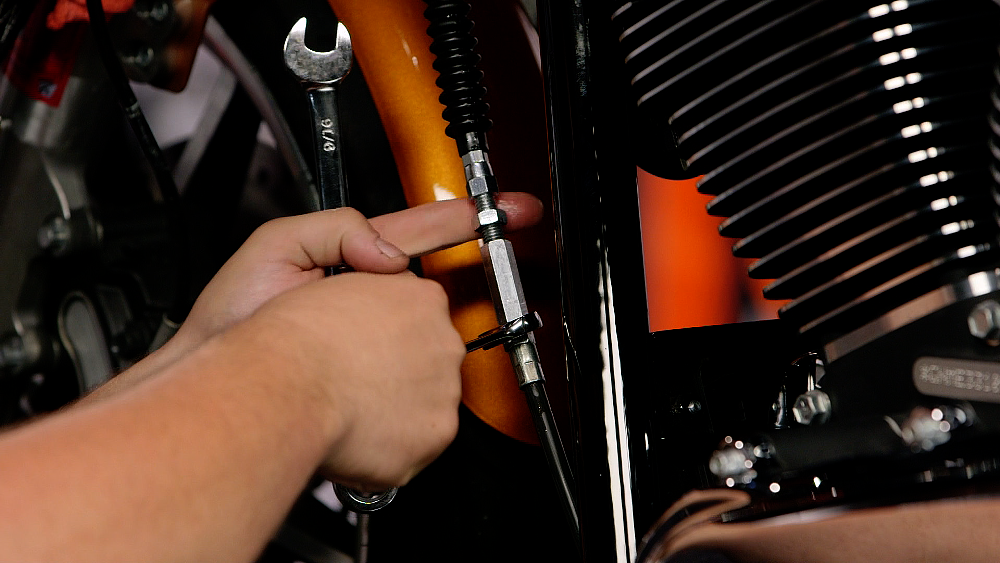 Adjust motorcycle cable