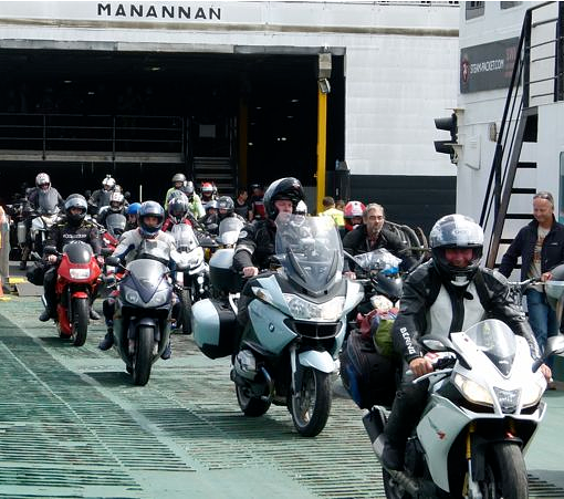 riders leaving ferry to Isle of Man