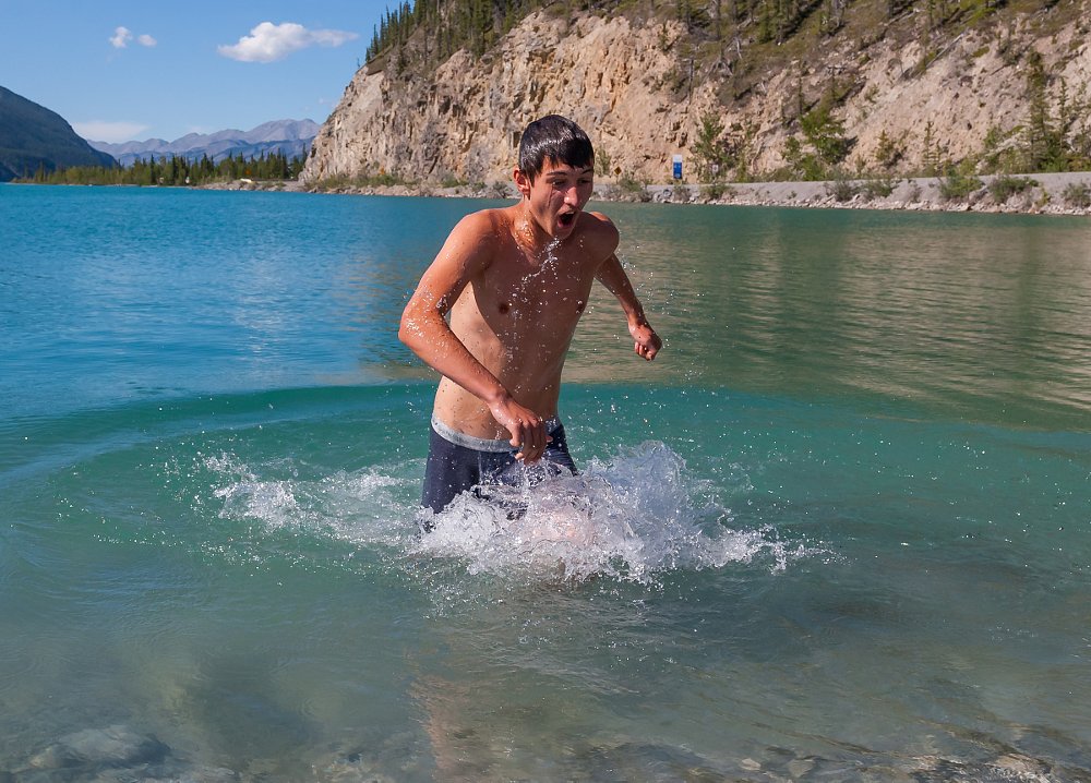 Patrick takes a dip in a cold lake