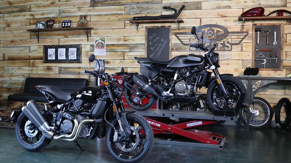 Indian FTR1200 and Husqvarna Svartpilen 701 in the J&P Cycles shop