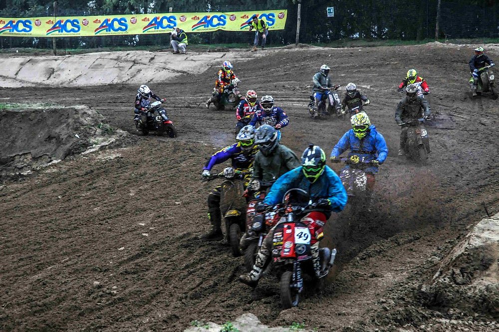 Zack & Ari racing vintage scooters on a motocross track in Italy