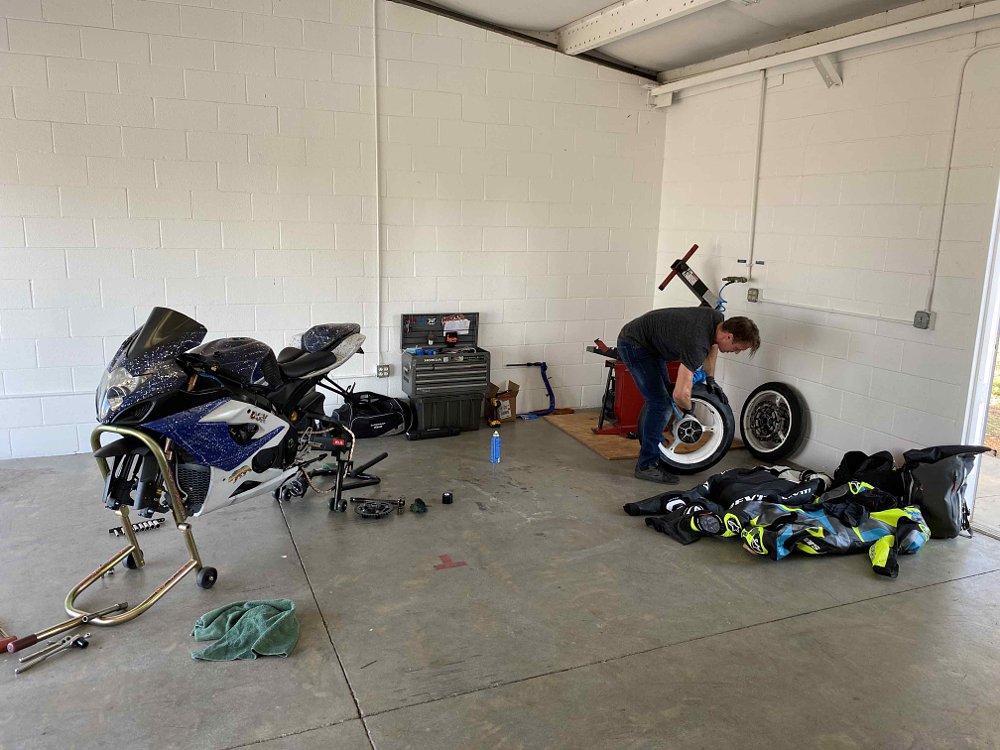 Suzuki GSX-R1000 gets a tire change in a garage