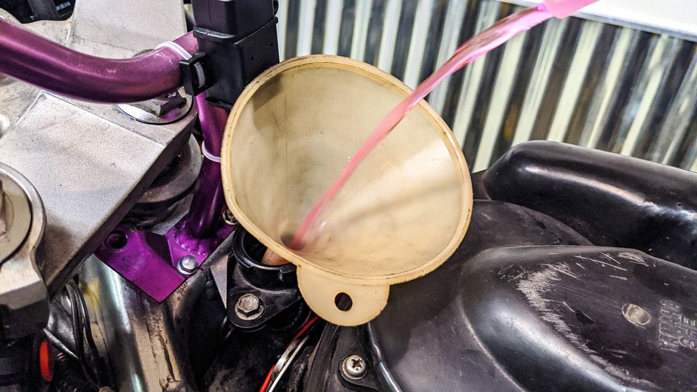 Pouring motorcycle coolant