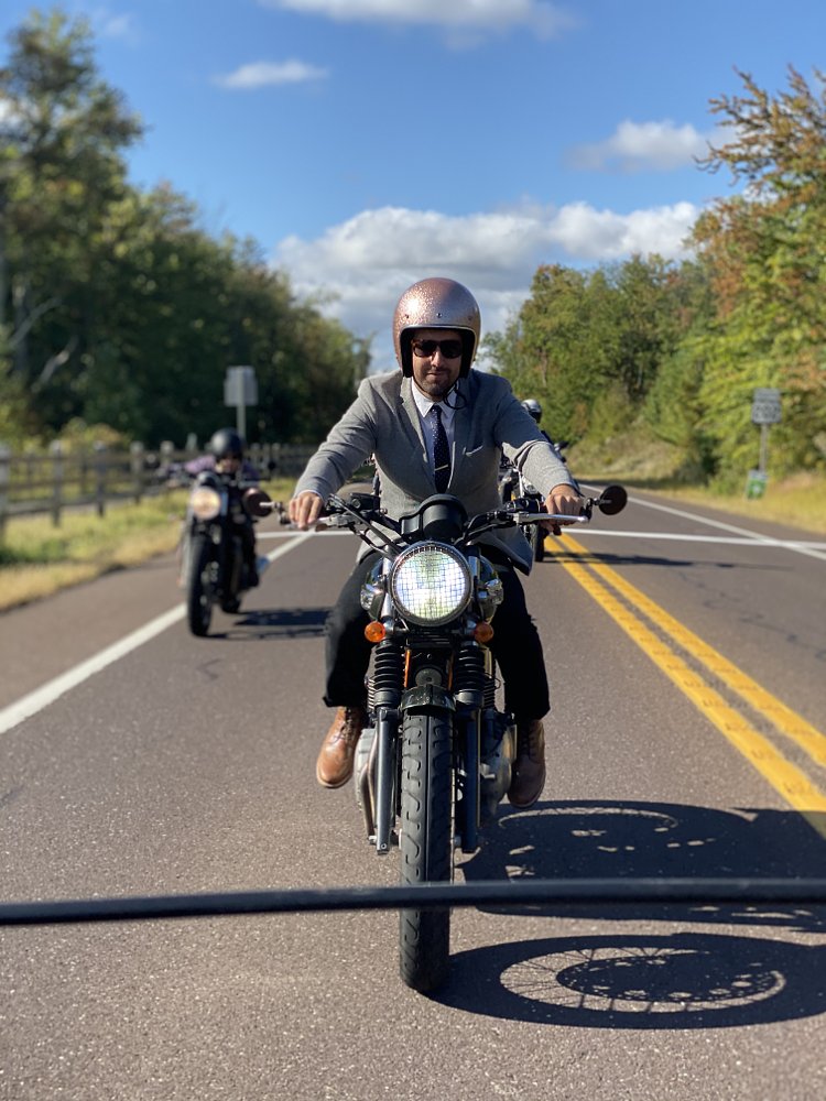 I am wearing a very cute pink sparkly helmet that gives me a nice big bobble head. Triumph Thruxton. Cafe Racer. The Distinguished Gentleman's Ride