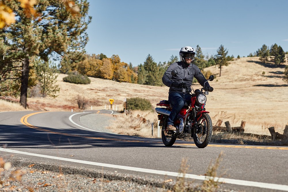Honda Trail 125 riding town a twisty paved road