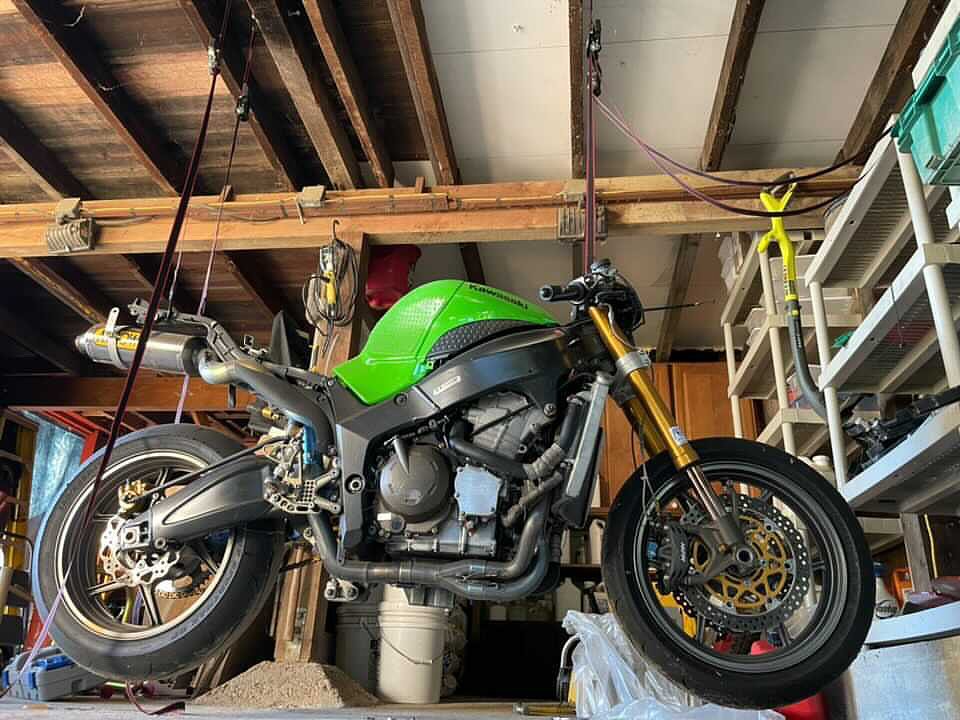 Hoisting a motorcycle using ratchet straps