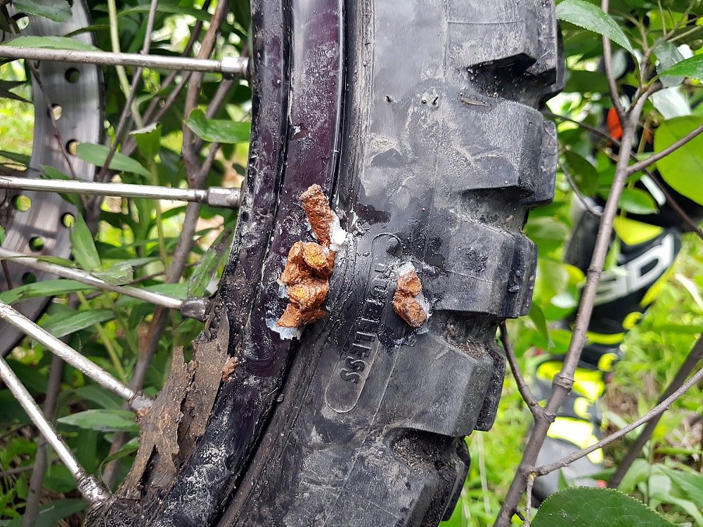 Emergency motorcycle tire repair with plugs