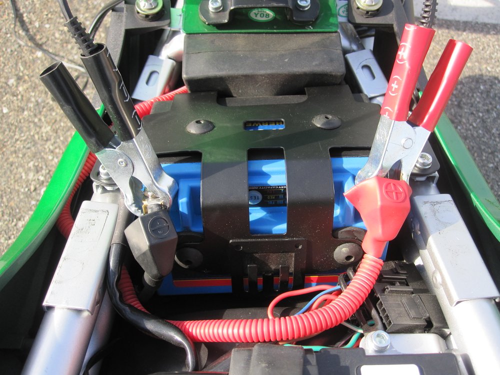 Jump starting a motorcycle battery.