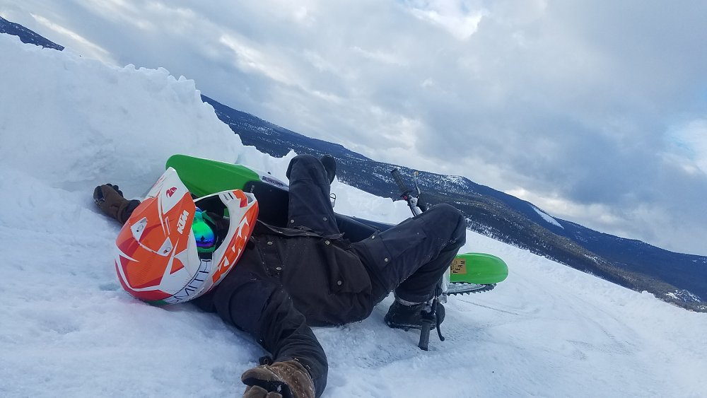 lying flat on the snow, post-crash