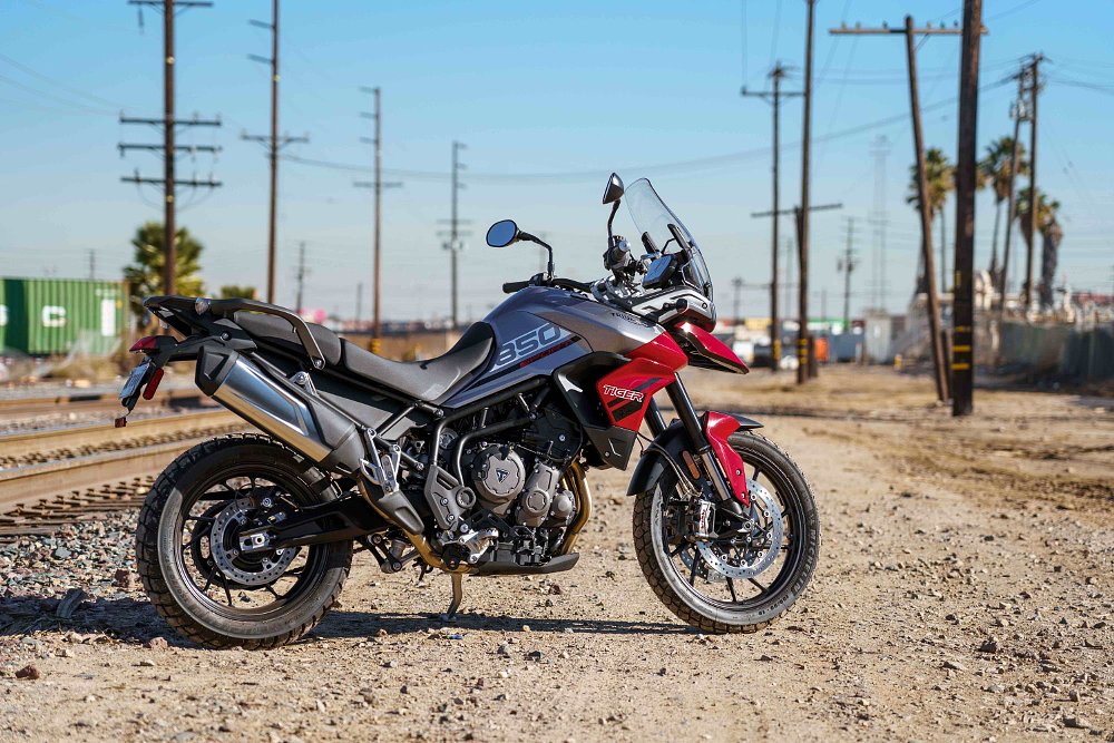 Triumph Tiger 850 Sport next to railroad tracks