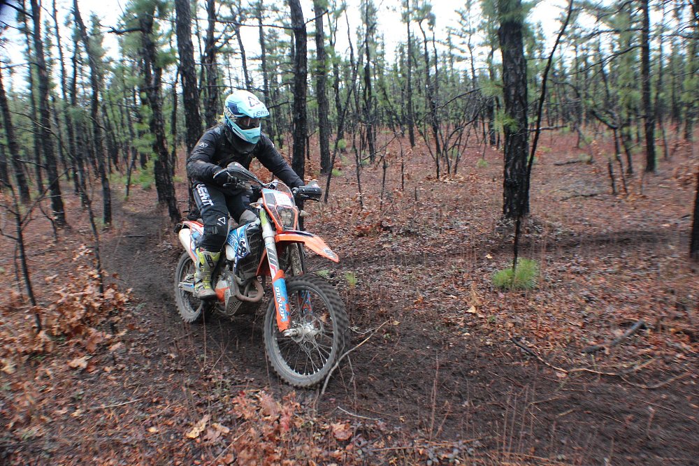 Rider competing in enduro in NJ pine forest