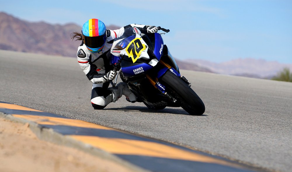 Jen Dunstan riding at the road race track