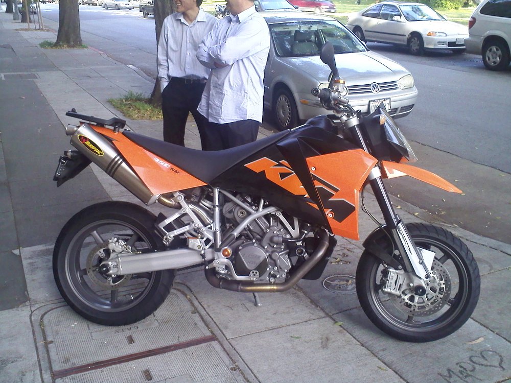 2006 KTM 950 SM sitting on a sidewalk