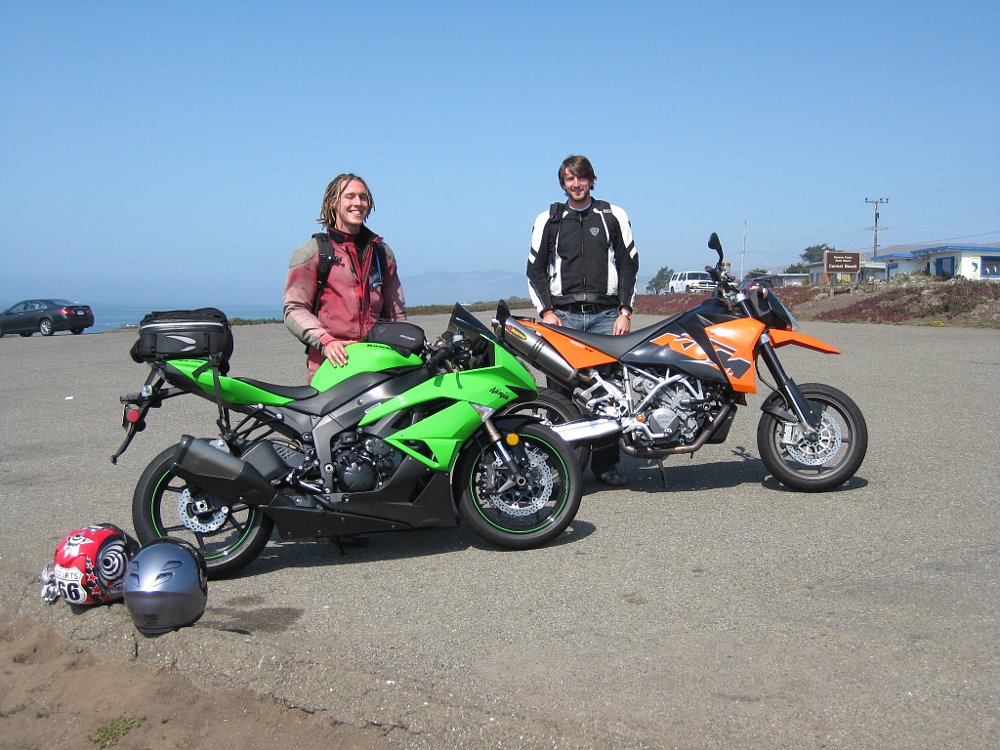 2009 Kawasaki ZX-6R and 2006 KTM 950 SM in a parking lot