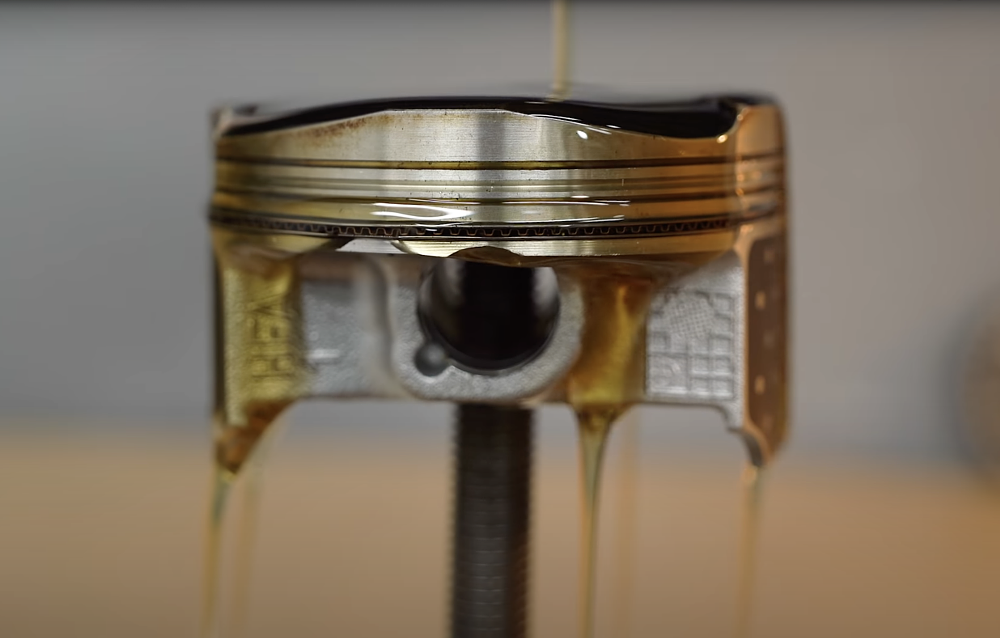 Motorcycle engine braking piston lubrication.