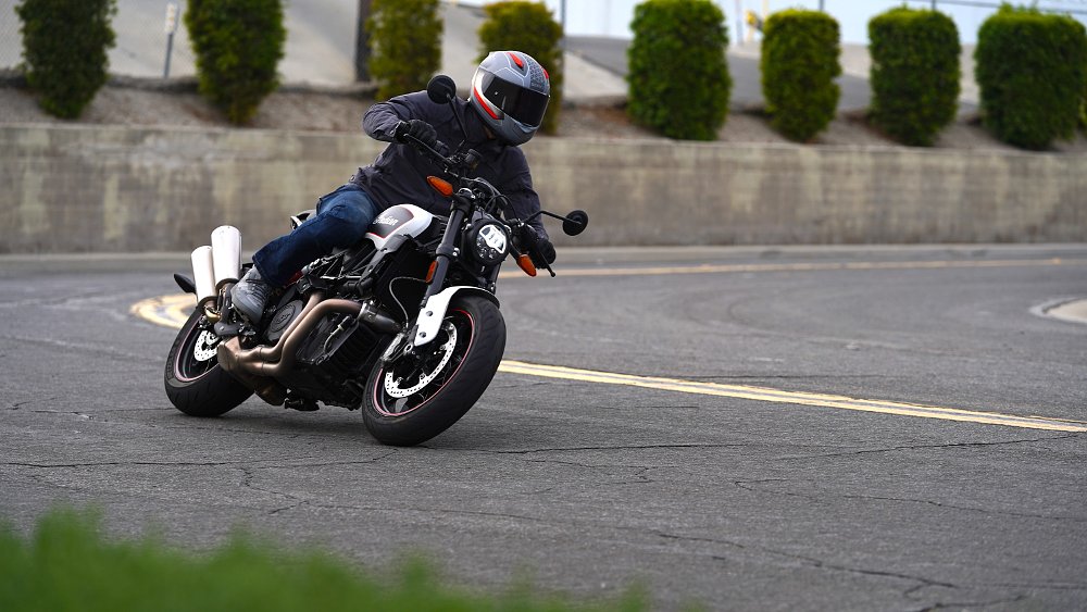 Indian FTR riding at camera in a left turn