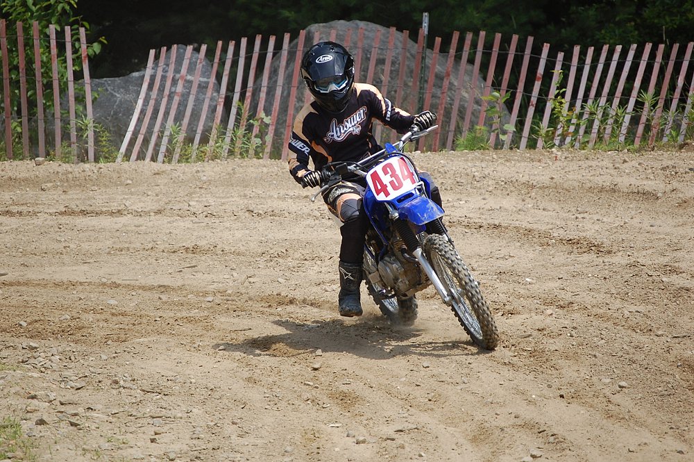 Yamaha TT-R 125 dirt bike in the corner of a MX track.