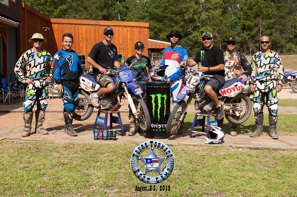 A group of riders pose with TT-R 125 from the Colin Edwards' Texas Tornado Boot Camp