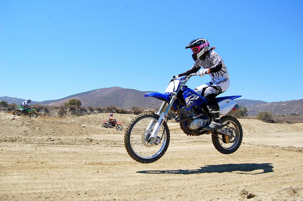 Yamaha TT-R 125 dirt bike jumping through the air