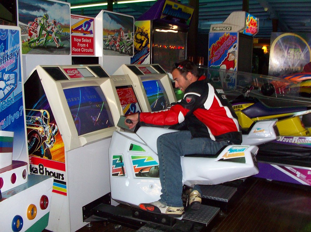 playing the motorcycle racing game in the arcade