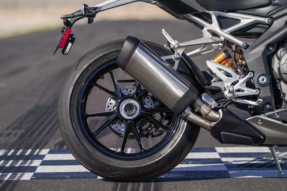 A close up view of the exhaust pipe on the Triumph Speed Triple 1200 RS