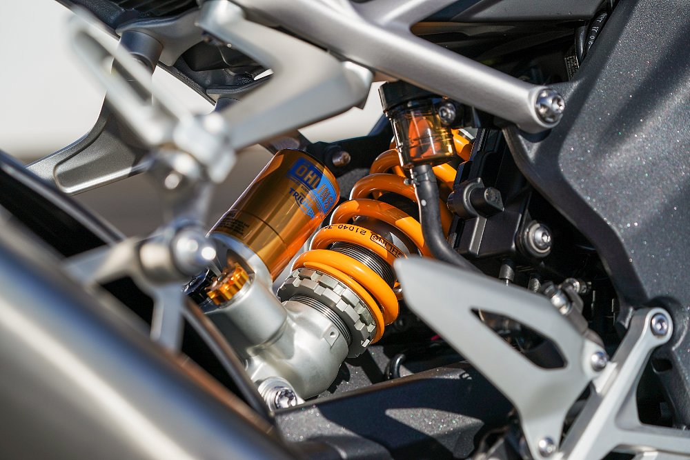 A close up view of the gold Ohlins rear shock on the Triumph Speed Triple 1200 RS.