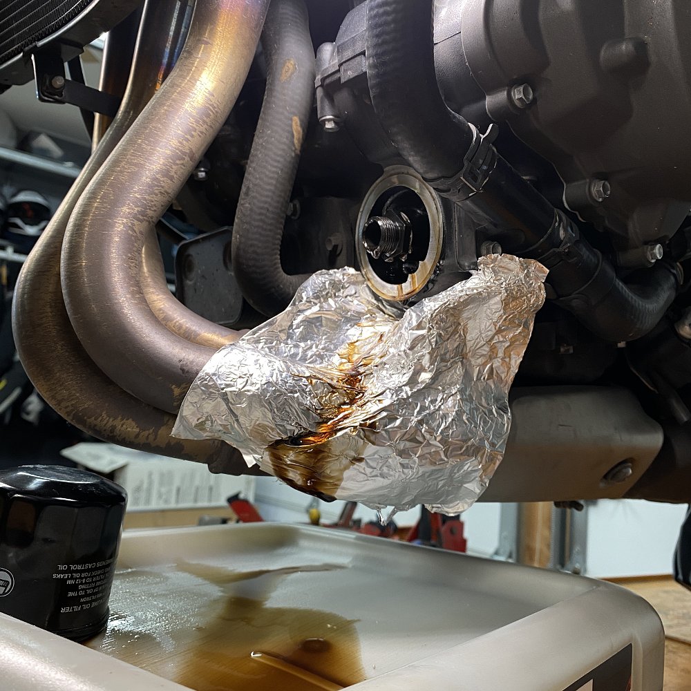 Foil on exhaust to prevent oil mess.