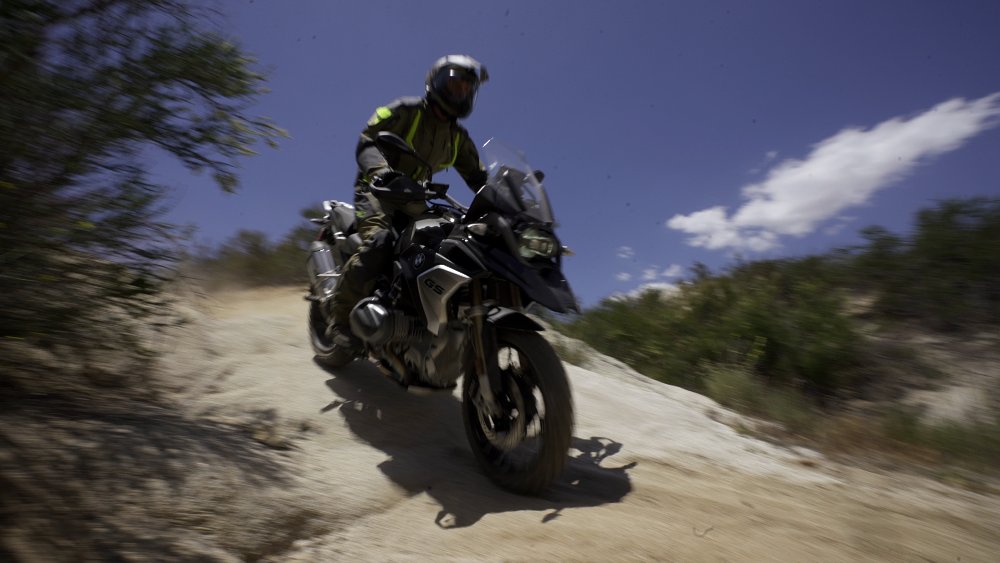 BMW R 1250 GS being ridden on a dirt trail