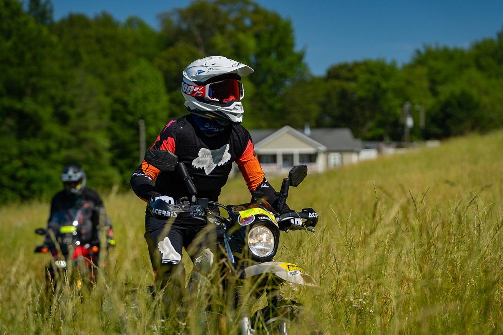 riding through a grassy field