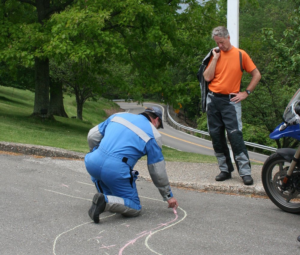 drawing lines with chalk to demonstrated riding techniques