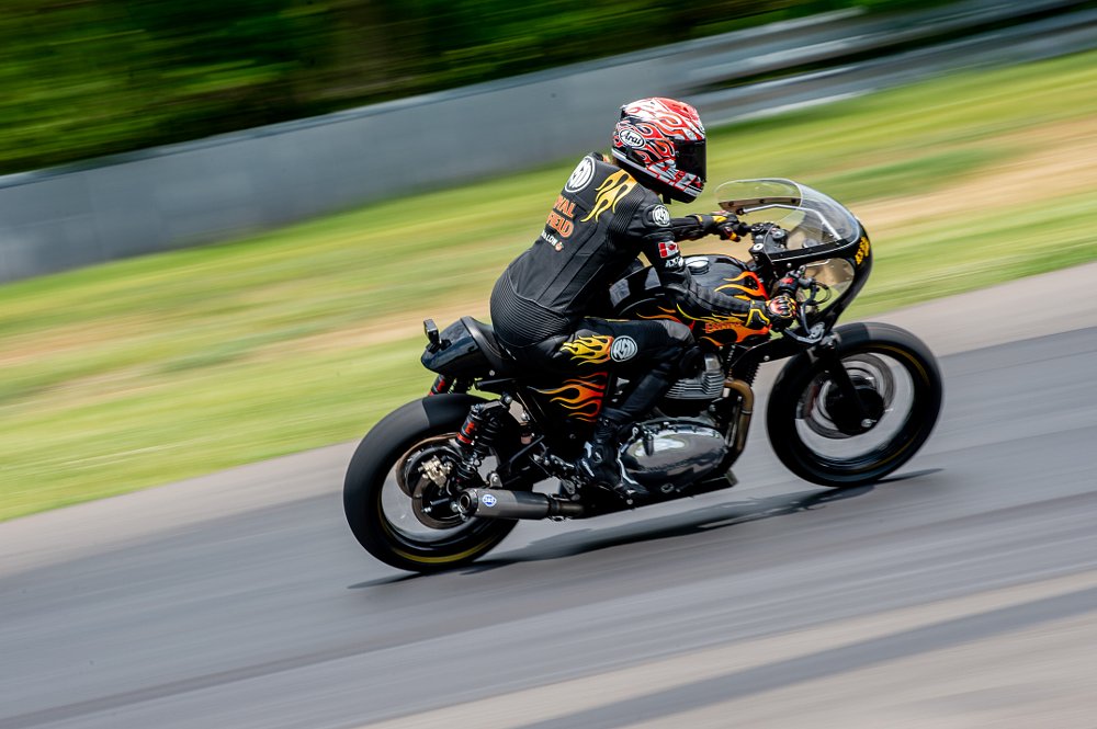BTR Racer Becky rides her race motorcycle with it's iconic flames paint job.