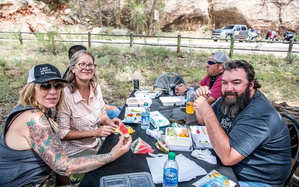 Sue Frey and Sharry Billings at a picnic meal on the road with veterans