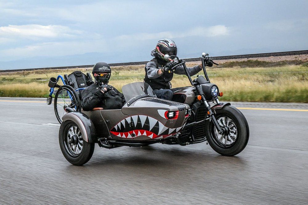 veteran with a wheelchair riding in a sidecar
