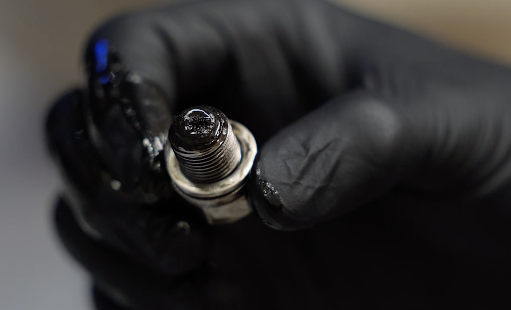 Gear fuzz on a magnetic drain plug.